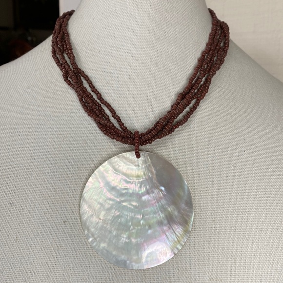 Jewelry - Large polished shell necklace brown seed beads